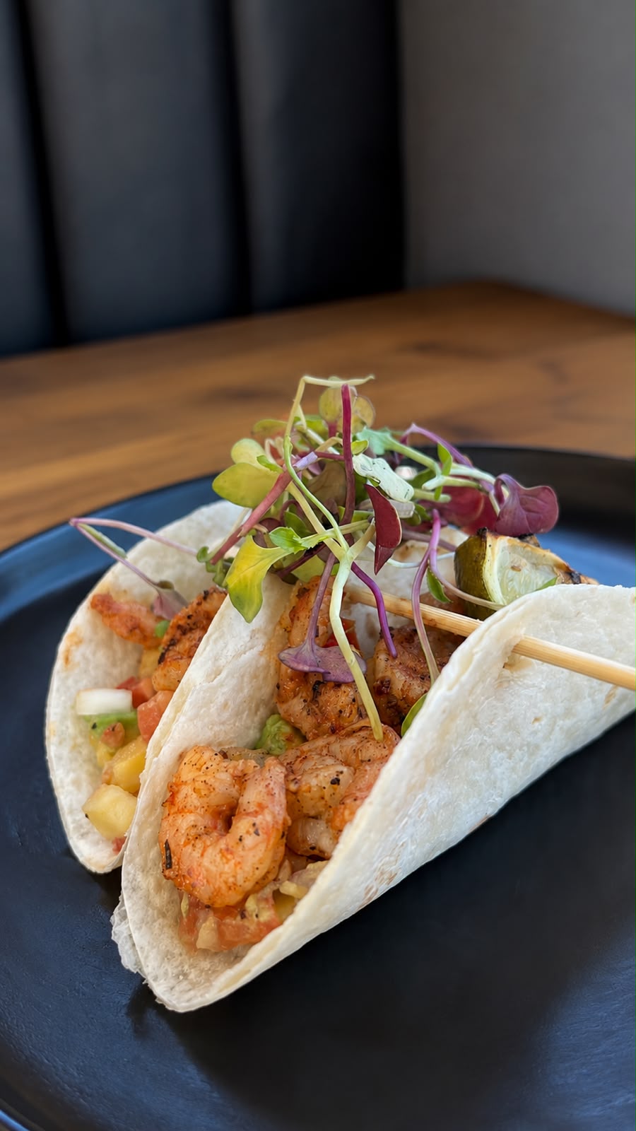 KRO Café prawn tacos on a black plate